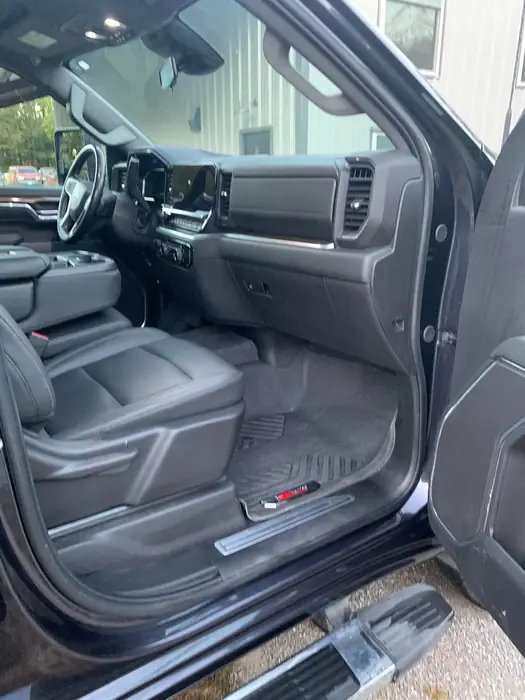 Cleaned front seats and door sill of a pickup truck after an interior detail