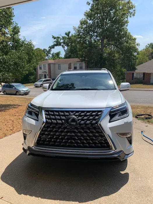 Silver Lexus SUV washed and gleaming on a residential driveway