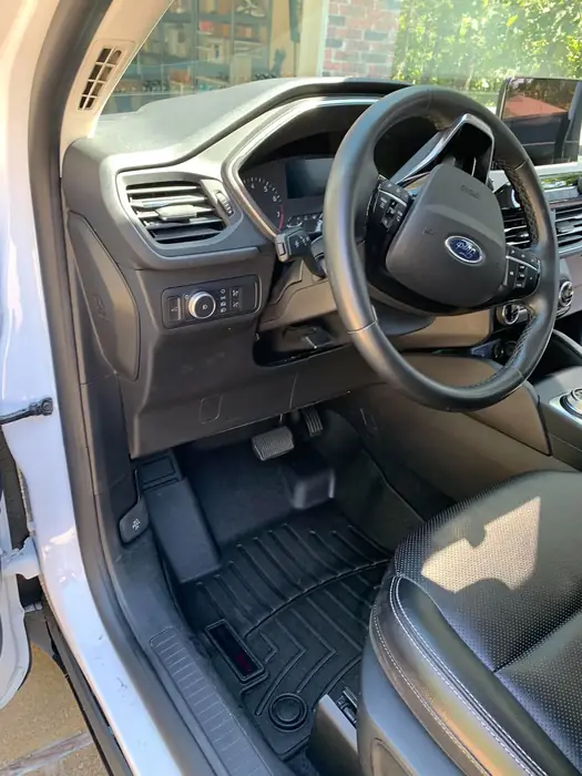Spotless dashboard, steering wheel and air vents after an interior detail