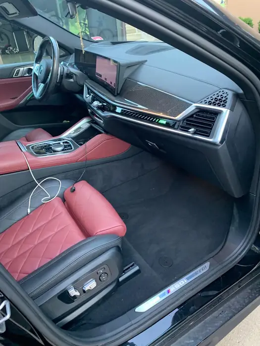 Car interior with red leather seats cleaned and conditioned