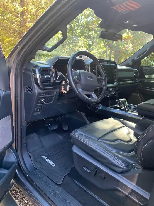 Pickup truck cabin after a full interior clean with the driver door open
