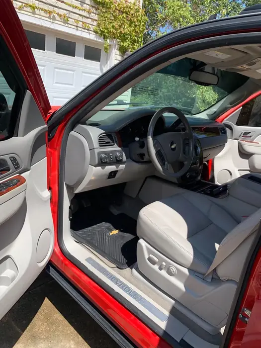 Red SUV with tan leather interior after an interior detail