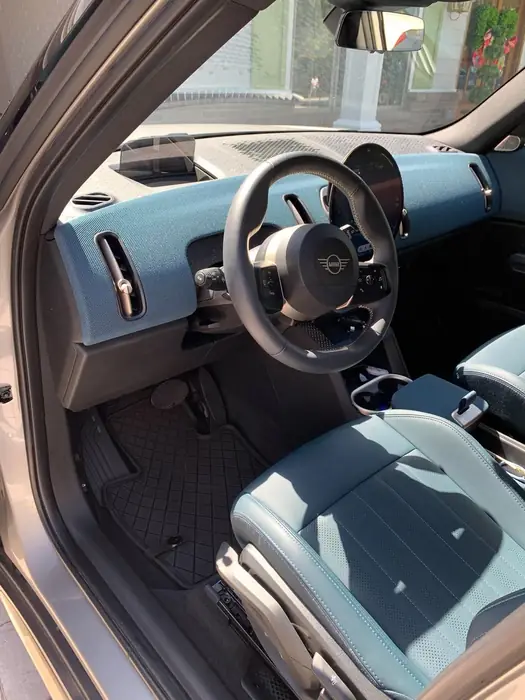 Clean steering wheel, dashboard and grey seats after an interior detail
