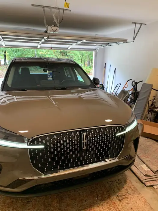 Bronze Lincoln sedan detailed inside a garage