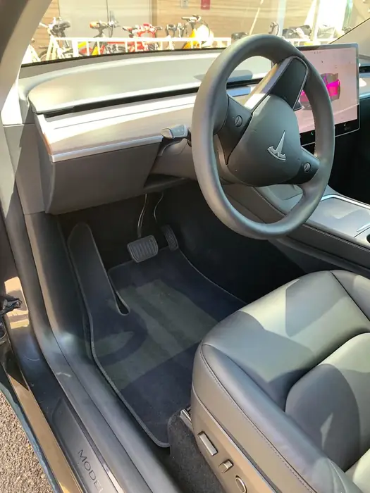 Tesla interior with light seats cleaned and dressed