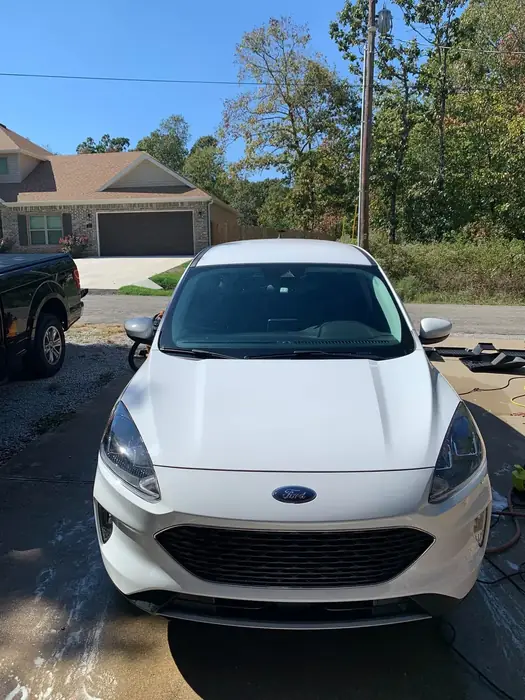 White Ford Escape detailed and parked in a driveway